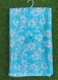 Blue fabric with white floral pattern and 'Siri' branding on a grass background
